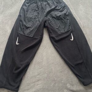 Black Nike Track Pants with Swoosh Logo